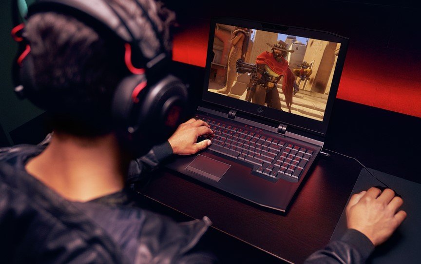 Person playing a laptop from the best gaming laptop brands